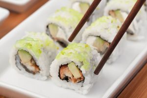 white and green sushi on white ceramic plate